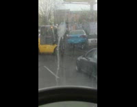 Forklift Places Blue Car into Parking Space 