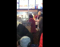 Woman in red jacket yells at Popeyes workers for a chicken sandwich 