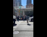 Man juggle pins on the street crosswalk