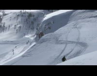 Yellow snowsuit ski backflip success snow 