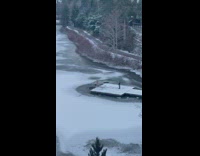 Man black shorts jump in freezing water