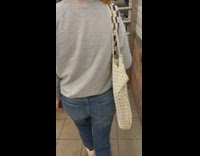 Multiple people at subway station carrying tote bags 