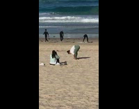 White shirt green leggings girl yoga beach 