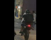 Black shirt guy air conditioner motorcycle sidewalk 