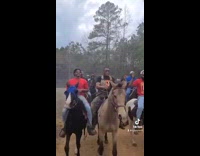 Group of men ride horses dont worry about gas