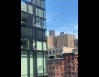 Man washes window at a high level