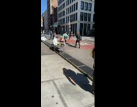 two girls film dance routine on street