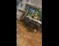 Four women selfie stick photo shoot restaurant