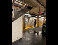 Collab WINY - Water floods down the subway station stairs