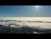 Fog and Clouds Envelops City at Morning