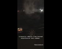  smoking black car street night time