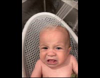 Baby cries when water pours on head