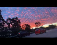 Beautiful sunset clouds along the highway car