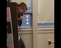 kid in black sweater behind drawer dabs