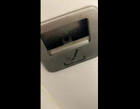 No Smoking sign with an ash tray inside the bathroom