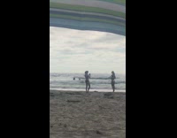 Girl white bikini tiptop side pose beach