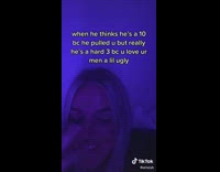 Woman blue light room hand on face laughing