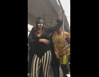 Superheros in costumes make a performance on subway train and run off