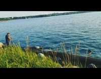 Woman lay on log with bird lake