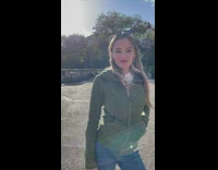 Woman in white top ripped jeans tiktok dance