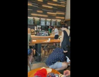 Guy steams clothes at starbucks 