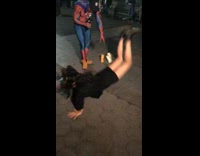 Girl does worm spiderman costume guy park 