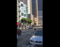 Woman black dress windy street photo shoot