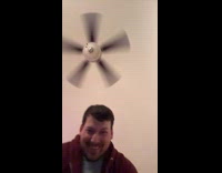 Man showing off grinch gloves from Walmart 