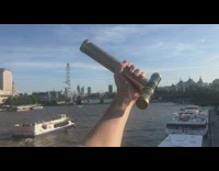 Guy look at London using kaleidoscope bridge