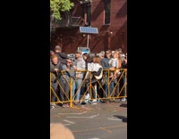 Woman holds board feet pics on marathon