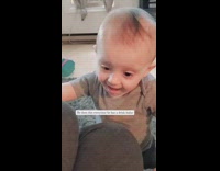 Baby Sates after a Drink from Cup