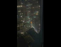 Wall street fireworks explode in between skyscrapers 