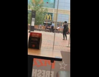 White skirt girl dances courtyard mcdonalds guy 