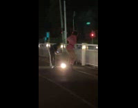 Woman pink outfit tiktok dance at bridge