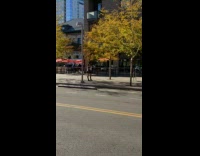 Black dress white shirt girl poses sidewalk 