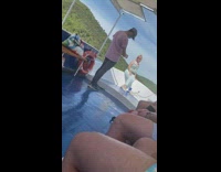 Woman blue top front boat pictorial tourist