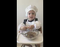 Baby boy highchair cracks egg chef hat