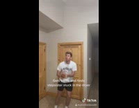 White shirt guy shoots toy basketball hoop