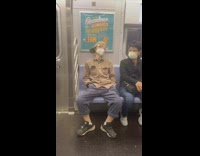 Guy white face mask blue orange goggles 