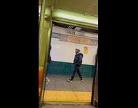 Man wear christmas tree with lights subway