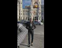 Tourist poses by cathedral church