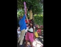 Woman accidentally hits dad instead of pinata