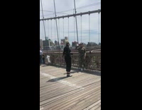 Two woman camouflage outfit tiktok dance video shoot bridge