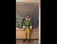 Guy wears Elf Costume for SantaCon