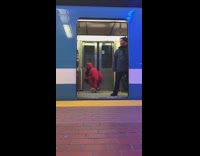 Red sweater guy spins around on hoverboard 