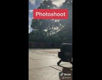 Shirtless guy holds large metal fork camera 