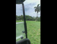 Guy films exercise video golf course grass