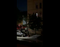 Woman wash her leg with fire hydrant