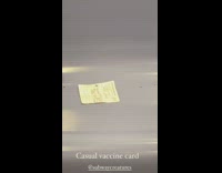 White covid vaccine card left on subway 