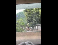 Guy rides bike wear box cover clothes